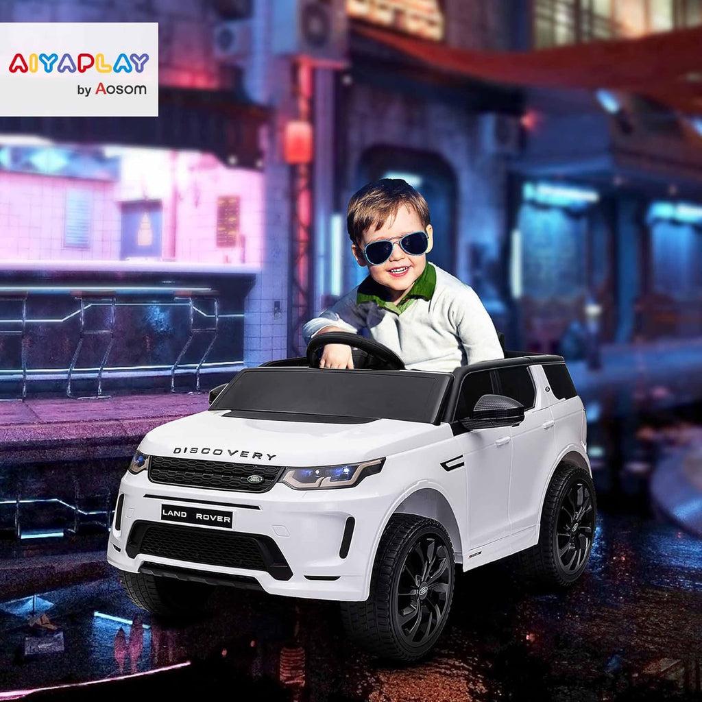 AIYAPLAY Coche Eléctrico para Niños de +3 Años con Licencia Land Rover Discovery Sport Carro Eléctrico Infantil con Batería 12V Mando a Distancia Arranque Lento Faros Bocina y Música Blanco